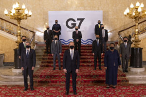 2021 G7 summit politicians standing in masks on a red carpet