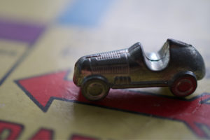 Model car on Monopoly board